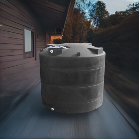 A black 3000 gallon fresh water storage tank with visible outlets and lids, placed outdoors near a residential building.
