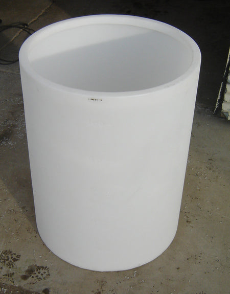 White cylindrical container on a concrete floor